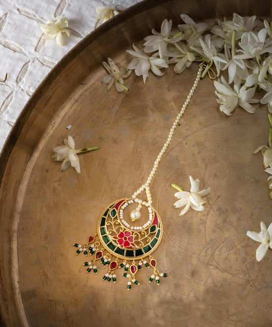 Handcrafted 925 sterling silver mangtika with pink and green floral enamel, pearl detailing, gold plating, and delicate bead drops.