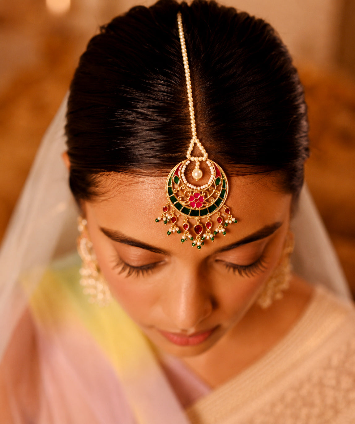 925 silver mangtika with colorful enamel floral detailing and dangling pearls and beads.