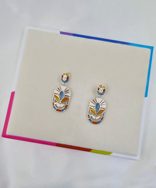 Floral dangle earrings crafted in 925 sterling silver with intricate meenakari work, anti-tarnish finish.