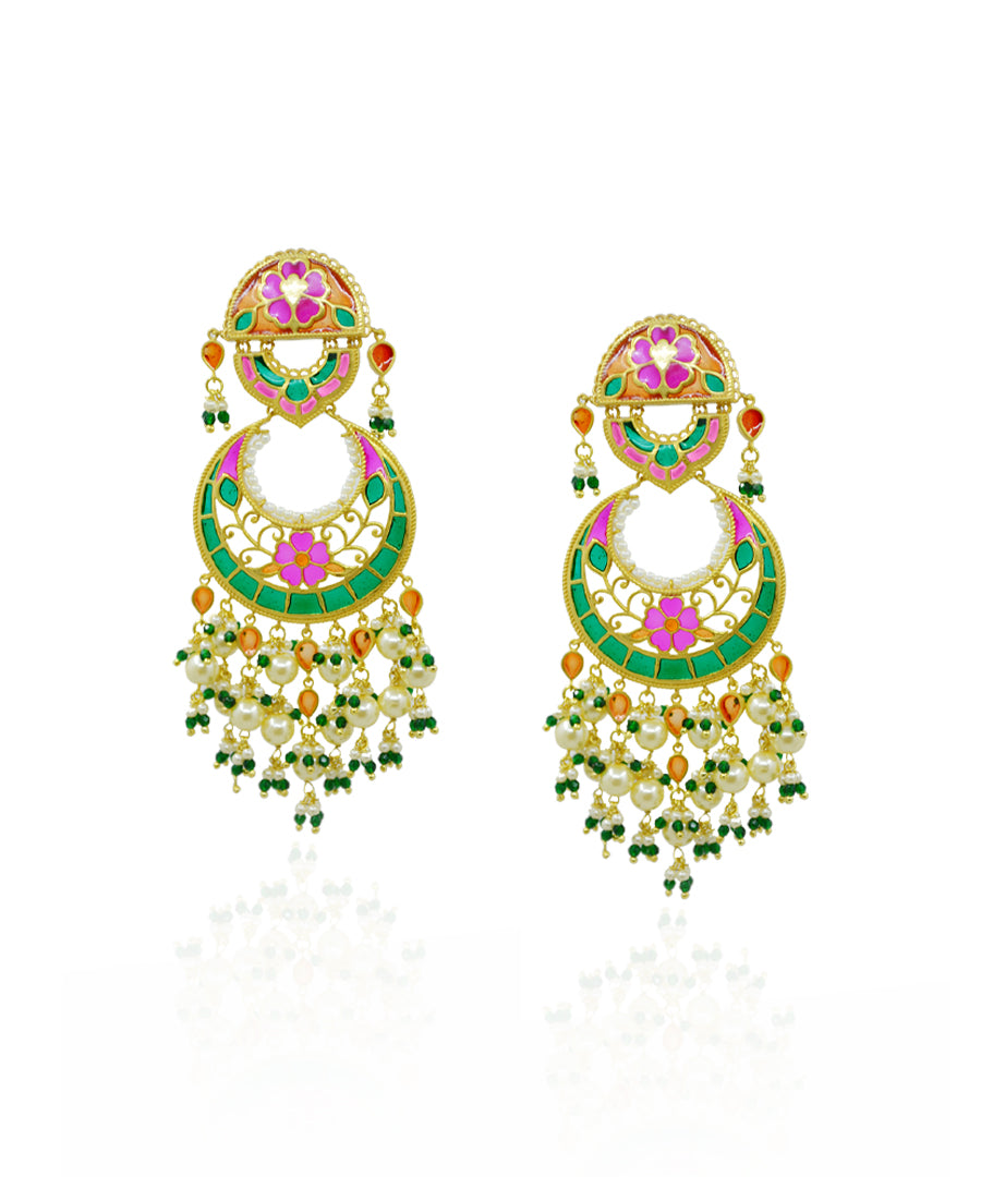 Colorful meenakari earrings with pink, green, and orannge accents on a white background handcrafted in silver with gold plating.