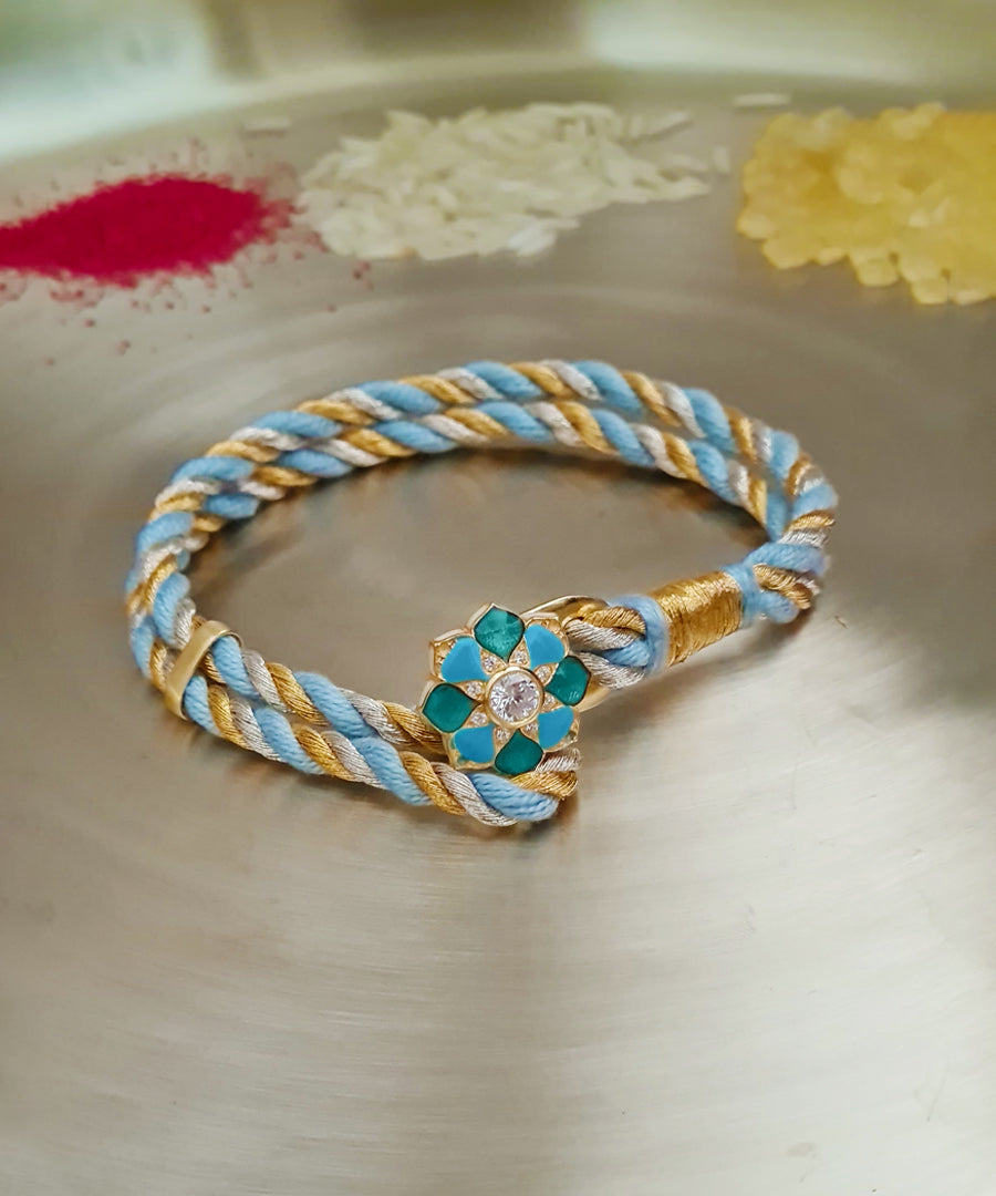 Floral sterling silver Rakhi with handcrafted silk thread