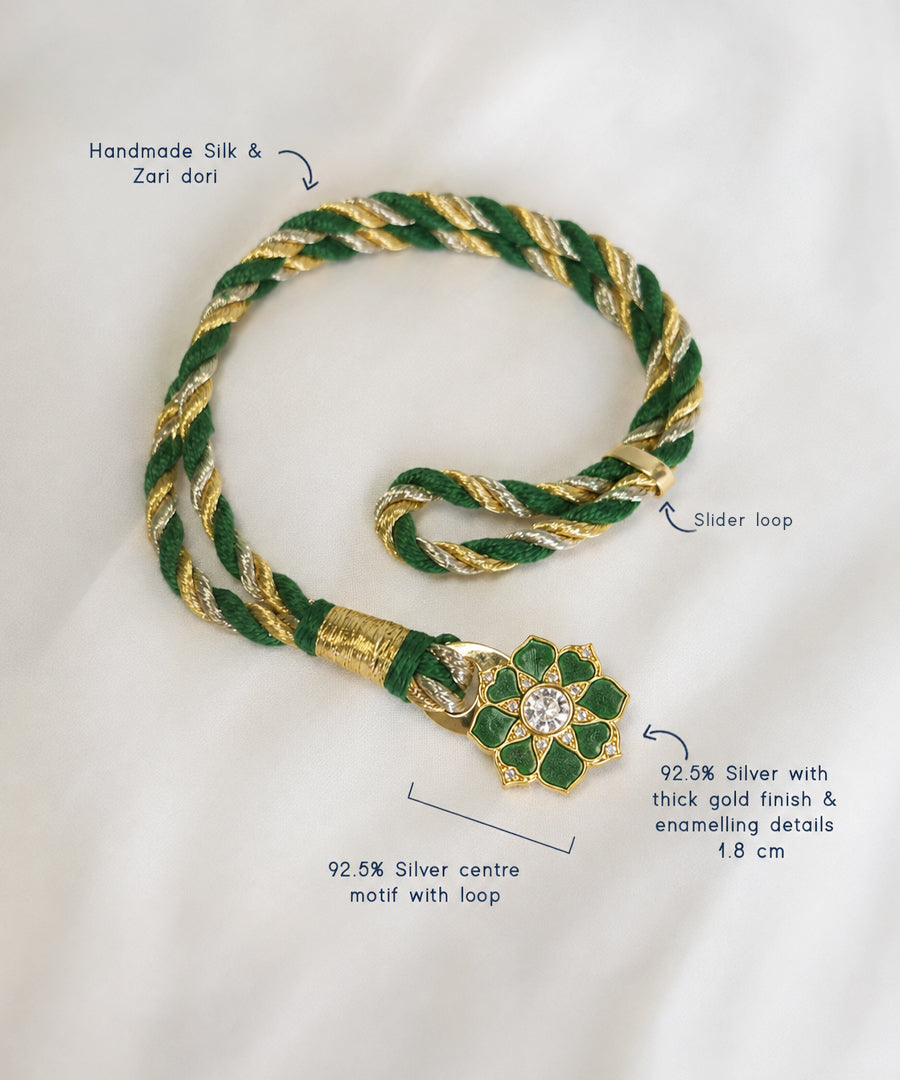 Silk and zari dori bracelet with a 925 silver floral motif.