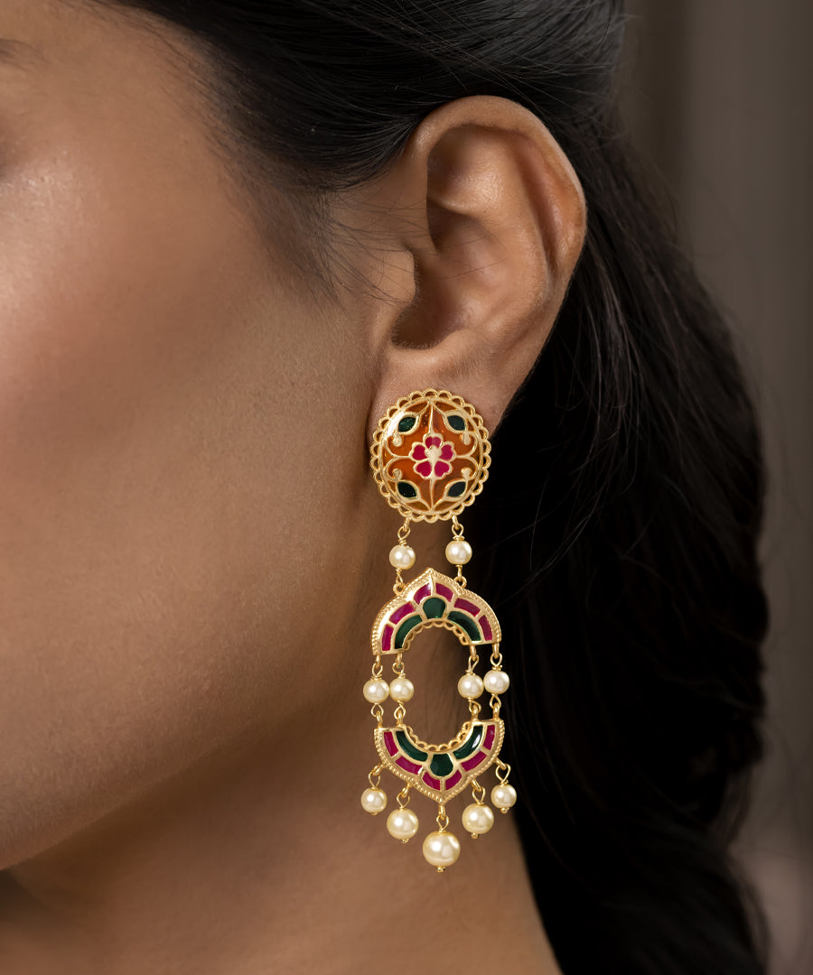 925 sterling silver Meenakari dangle earrings with pink, orange and green enamel, pearl drops, and gold plating inspired by traditional craftsmanship.