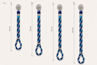 925 silver rakhi bracelets in sizes S, M, L, and XL shown vertically with measurements. The rakhi have silver-floral motif ends, blue and white silk zari threads.
