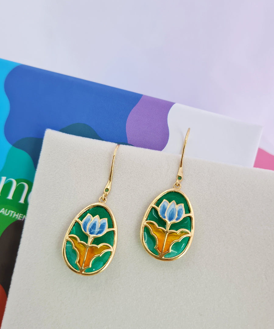 Traditional lotus hook earrings in 925 silver, gold-plated with fine handcrafted meenakari work.