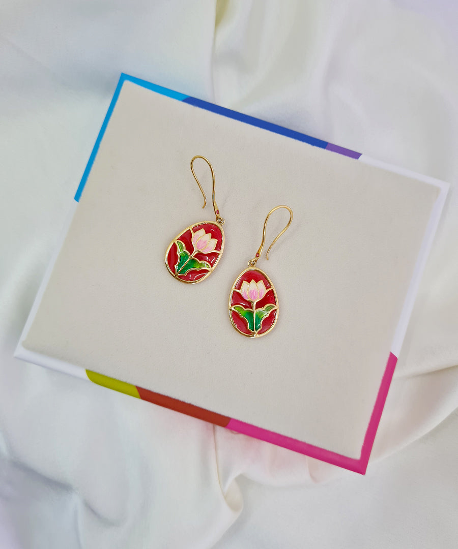 Lotus hook earrings crafted in 925 sterling silver, gold-plated with colorful meenakari accents.