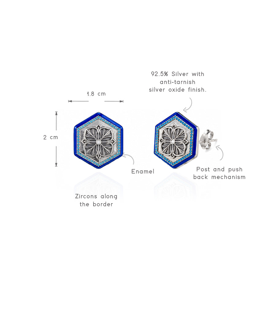 Magnolia stud earrings with a refined blue finish.