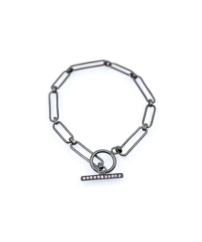 Chain bracelet in sterling silver with toggle lock mechanism studded with zircons.