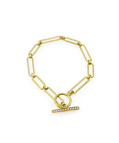 Toggle lock chain bracelet made in silver with gold plating.