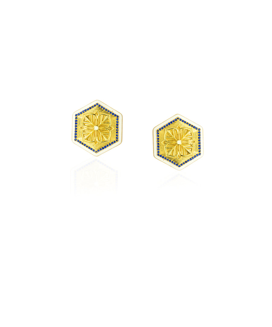 Magnolia-inspired small stud earrings with blue zircon and elegant gold finish.