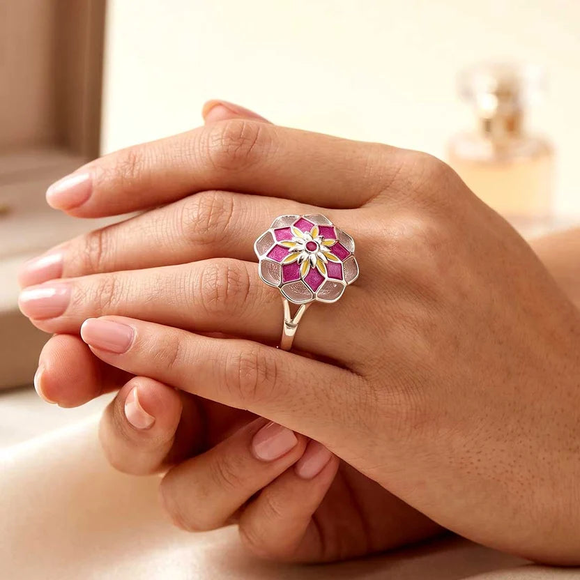 A statement adjustable ring handcrafted in 92.5% sterling silver, featuring vibrant transparent enamel details in a floral motif and finished with a high-quality anti-tarnish protective coating.