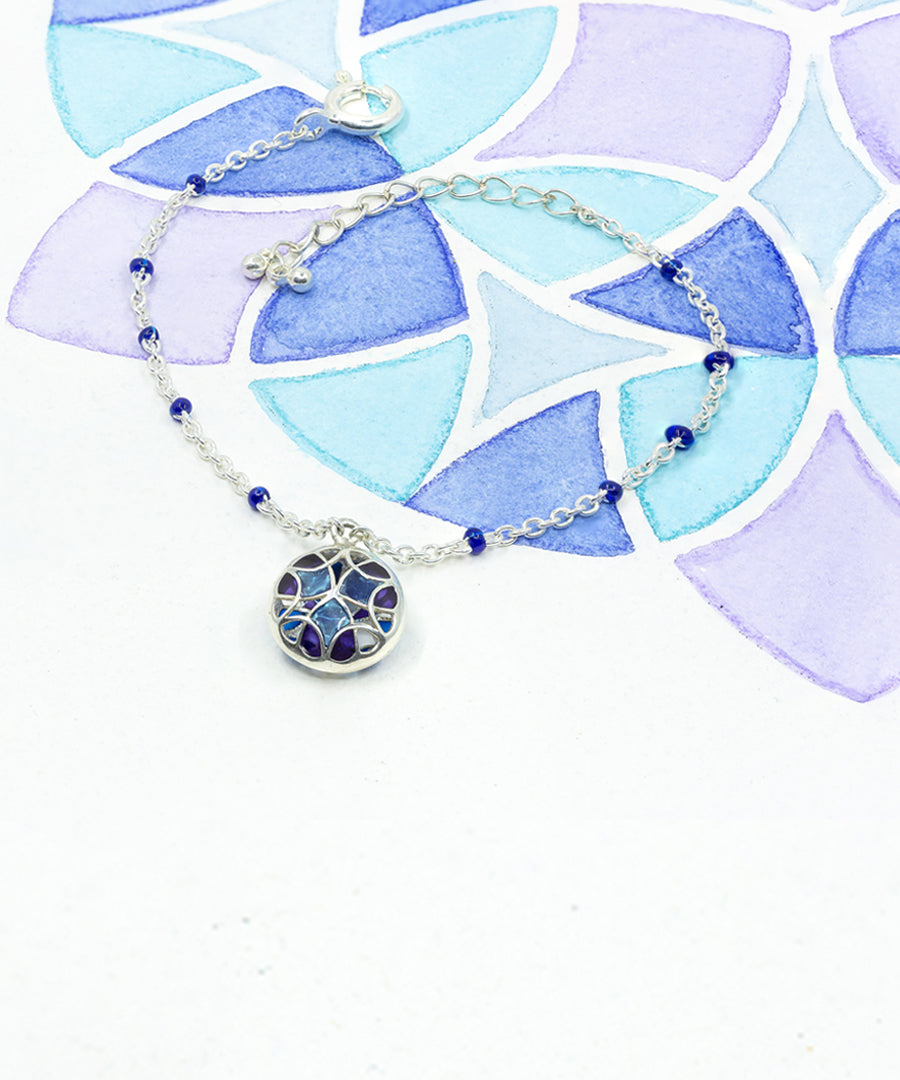 Kaleidoscope tarnishfree silver bracelet with hanging charm 