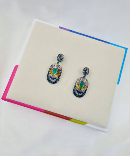 Festive handcrafted 925 sterling silver floral earrings featuring green and yellow meenakari enamel with black rhodium finish.