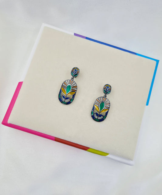 Festive handcrafted 925 sterling silver floral earrings featuring green and yellow meenakari enamel with black rhodium finish.